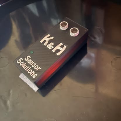 The K&H sensor — a compact branded enclosure, designed and assembled by K&H